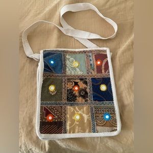 Embroidered sling bag